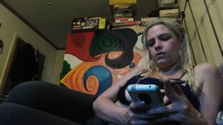 Beauty blonde smokes clove cigarettes, plays on phone and plays with hooters
