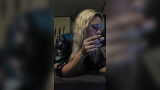 Smokes a joint, plays with herself, and answers message from work on phone
