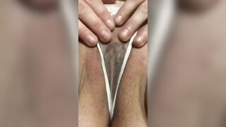 Lady RhaRha caresses her soak twat inside her watch-through, white WW g-string Pt.one