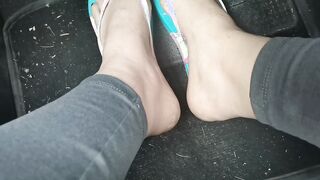 Nicoletta's cute little foot into flip-flops press on the pedals