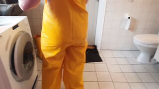 Getting clothed into greasy rainpants and pvc boots ready for sex