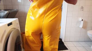 Getting clothed into greasy rainpants and pvc boots ready for sex