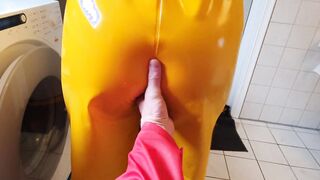 Getting clothed into greasy rainpants and pvc boots ready for sex