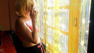 Beauty Cougar Smoking Near Hotel Room Window - Sunny Day