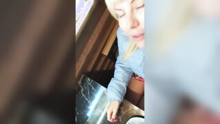 Risky sexy shows sweet twat inside café