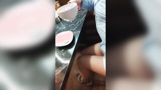 Risky sexy shows sweet twat inside café