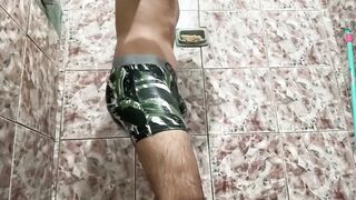 Young man takes off his panties inside the bath tub