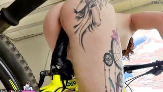 2 BRAND NEW PEOPLE SITTING ON A BIKE ON A