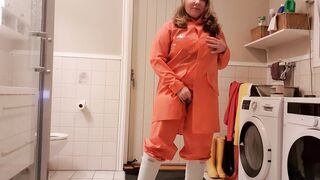 Having Fun with oil and rainwear getting ready for sex