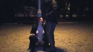 A hoe ex-wife drinks a piss inside a outside park