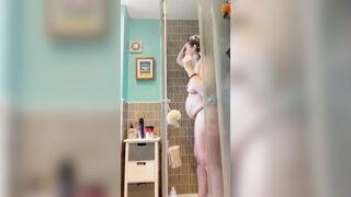 Pregnant red head mom getting undressed and taking a shower