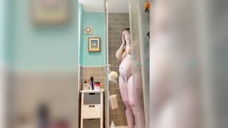Pregnant red head mom getting undressed and taking a shower