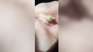 Banana w/ condom into it, squirting inside the end!