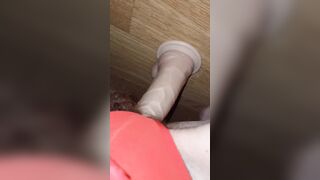 Sitting on huge white sex toy close up