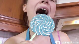 Cutie mom Enjoying blowing on a lollipop