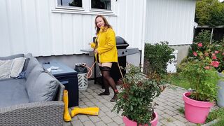 Getting clothed inside rubber dress, stay ups, raincoat and latex boots