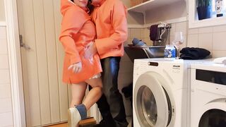 Greasing up big jugs inside raincoat and latex boots