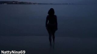 Hispanic mom Takes an Evening Beach Stroll