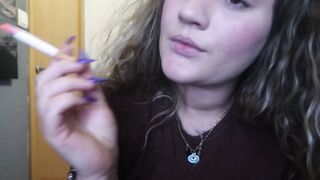 CLOSE UP CIGAR SMOKE BY A BEAUTY BLONDE WOMAN