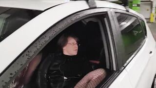 Caught woman inside vehicle masturbating with vibrator into outdoors parking lot