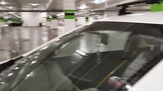 Caught woman inside vehicle masturbating with vibrator into outdoors parking lot