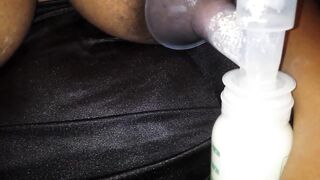 Ebony pumping milk out of her big melons and nipples