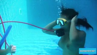 Underwater lesbians lick and suck dildos