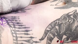 Sascha plays with Amber Luke while she gets inked
