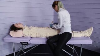 Figging with red head and Foley bladder catheterization inside fetish body bag. Medical play.
