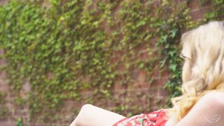 See Charlie Forde sits on the pavement and fucks herself with her fingering til she squirts
