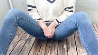 The ex-wife of jeans waiting on the veranda inside the cold can't stand the peeing and pees little by little