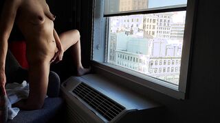 Masturbating from the window of my hotel inside the center of town