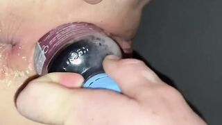 Popping her snatch with a pop bottle and filling her arse with a syringe containing Columbia compound