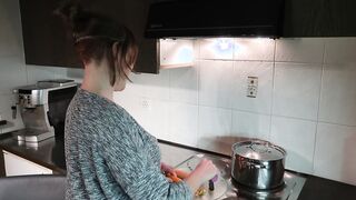 Long boobs woman cooks inside the kitchen