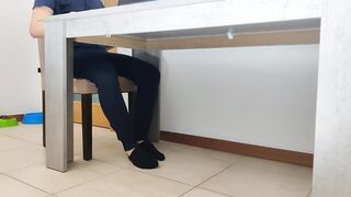 Milf giving hand job under the table