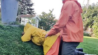HornyMILF gets filled with huge cock wearing rainwear and pvc boots outdoor