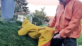 HornyMILF gets filled with huge cock wearing rainwear and pvc boots outdoor