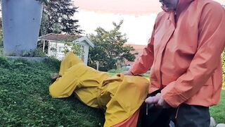 HornyMILF gets filled with huge cock wearing rainwear and pvc boots outdoor