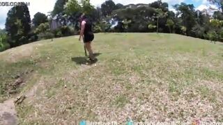 19 year old hispanic walks through a outdoors park into medellin colombia