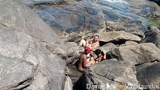 Naturists caught on the beach at an outside group sex -