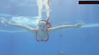Dark Hair long jugs sexy Mia Ferrari swims in the pool