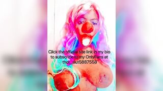Goddess CLOWN blowing on a banana and having fun with her titties