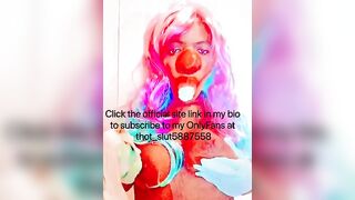 Goddess CLOWN blowing on a banana and having fun with her titties