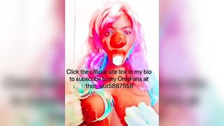 Goddess CLOWN blowing on a banana and having fun with her titties