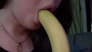 At home watching tv while im blowing a banana