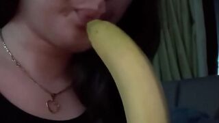 At home watching tv while im blowing a banana