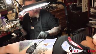 Marie Bossette touches herself while being inked