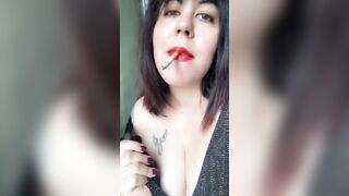 She smokes and moves provocatively inside the WC while changing clothes