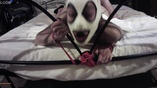 She's bound up on a bed with a front camera,