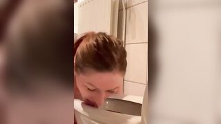 Pisswhore cleans up her mess from the toiletseat